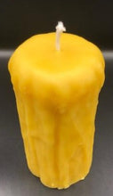 Load image into Gallery viewer, Rustic Beeswax Pillar candle with wax drip pattern flowing down the sides.