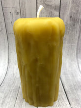 Load image into Gallery viewer, Rustic Beeswax Pillar candle with wax drip pattern flowing down the sides.