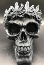 Load image into Gallery viewer, Large, Creepy, gothic skull beeswax candle with leaf crown. Eyes glow when lit. Halloween decor or gothic decor.