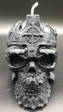 Load image into Gallery viewer, Creepy, ornate skull beeswax candle with cross crown. Eyes glow after it starts to burn down.