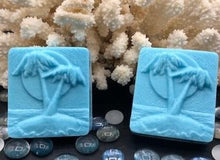 Load image into Gallery viewer, Ocean themed designs for our Ocean Breeze scented soaps. Blue palm trees by the beach and dragonfly designs pictures. Fresh ocean breeze scent takes you right back to the tropics as it soothes & cleanses your skin. The moisturizing oils used in our soaps produce a rich luxurious lather that leaves your skin clean & soft without stripping the natural oils. Perfect for Valentine's Day gifts, Christmas gifts, birthday gifts, wedding shower gifts, Mother's Day gifts & more!