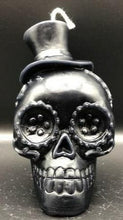 Load image into Gallery viewer, Celebrate the Day of the Dead, All Souls Day or All Saints Day with these adorable Sugar Skull Beeswax Candles.  Many cultures believed that the gates of heaven are opened at midnight on October 31, and the spirits of all deceased children (angelitos) are allowed to reunite with their families for 24 hours. On November 2, the spirits of the adults come down to enjoy the festivities that are prepared for them.  Families celebrate the lives of their departed loved ones.