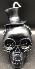 Load image into Gallery viewer, Celebrate the Day of the Dead, All Souls Day or All Saints Day with these adorable Sugar Skull Beeswax Candles.  Many cultures believed that the gates of heaven are opened at midnight on October 31, and the spirits of all deceased children (angelitos) are allowed to reunite with their families for 24 hours. On November 2, the spirits of the adults come down to enjoy the festivities that are prepared for them.  Families celebrate the lives of their departed loved ones.