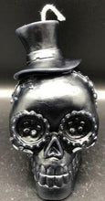 Load image into Gallery viewer, Celebrate the Day of the Dead, All Souls Day or All Saints Day with these adorable Sugar Skull Beeswax Candles.  Many cultures believed that the gates of heaven are opened at midnight on October 31, and the spirits of all deceased children (angelitos) are allowed to reunite with their families for 24 hours. On November 2, the spirits of the adults come down to enjoy the festivities that are prepared for them.  Families celebrate the lives of their departed loved ones.