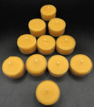 Load image into Gallery viewer, Timeless, classic tealight candles. With a long burn time, you can illuminate any space you'd like with the warm glow of these adorable candles. These make great gifts or souvenirs, especially for any nature lovers that you know. These are completely beeswax, nothing added. Your package will burst with a delicious explosion of warm and sweet honey scent as soon as you open it.  Great for use in worship, prayer, meditation, at an alter, rituals, showers, weddings or just to pamper yourself.