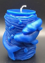 Load image into Gallery viewer, Mother and baby whale swirl around the outside of this all natural beeswax candle. Around the whales is an ocean wave design. Handmade in the USA.  Blue Shown.  Also available in natural yellow beeswax.