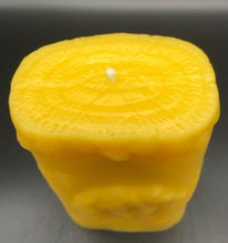 Load image into Gallery viewer, This two sided oval candle depicts a dear in a pine forest jumping on one side and a bear in the forest on the opposite side. The edges of this oval candle are adorned with a pine tree design. Top View. Handmade in the USA.