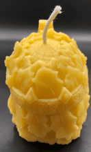 Load image into Gallery viewer, Creepy, ornate skull beeswax candle with cross crown.  Eyes glow after it starts to burn down.  Back view.