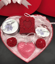Load image into Gallery viewer, Unique Valentines Day Gift in red, heart shaped gift box. Set includes 1 red beeswax Love & Roses Candle, 1 Lavender Lotion Bar, 1 Lavender Bath Bomb, 1 Lavender or Rose Geranium scented Heart Shaped Goat's Milk Soap & 2 Beeswax Red Rose Ball Candles. Perfect for Valentines Day Gifts!