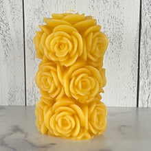 Load image into Gallery viewer, Bring timeless elegance and the warm glow of natural beeswax into your home with this handcrafted Rose Beeswax Pillar Candle. Beautifully sculpted with delicate rose petals, this stunning floral candle creates a cozy ambiance while showcasing the natural beauty of pure American beeswax.
