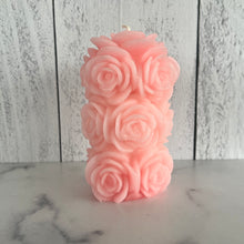 Load image into Gallery viewer, Bring timeless elegance and the warm glow of natural beeswax into your home with this handcrafted Rose Beeswax Pillar Candle. Beautifully sculpted with delicate rose petals, this stunning floral candle creates a cozy ambiance while showcasing the natural beauty of pure American beeswax.
