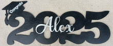 Load image into Gallery viewer, Celebrate your graduate with this personalized wooden graduation sign. An ideal alternative to a traditional guestbook, it features their graduation year, making it a great photo prop for the special day. Show your support in style with this meaningful keepsake.
