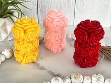 Load image into Gallery viewer, Bring timeless elegance and the warm glow of natural beeswax into your home with this handcrafted Rose Beeswax Pillar Candle. Beautifully sculpted with delicate rose petals, this stunning floral candle creates a cozy ambiance while showcasing the natural beauty of pure American beeswax.
