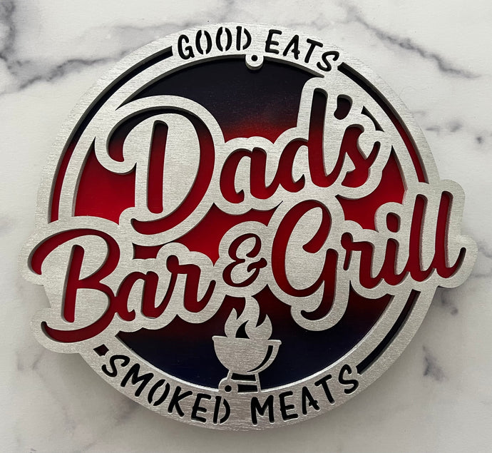 Dad’s Bar & Grill sign with blue & red background.  