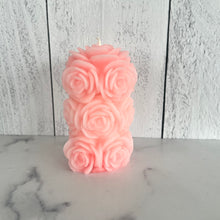 Load image into Gallery viewer, Bring timeless elegance and the warm glow of natural beeswax into your home with this handcrafted Rose Beeswax Pillar Candle. Beautifully sculpted with delicate rose petals, this stunning floral candle creates a cozy ambiance while showcasing the natural beauty of pure American beeswax.
