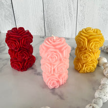Load image into Gallery viewer, Bring timeless elegance and the warm glow of natural beeswax into your home with this handcrafted Rose Beeswax Pillar Candle. Beautifully sculpted with delicate rose petals, this stunning floral candle creates a cozy ambiance while showcasing the natural beauty of pure American beeswax.
