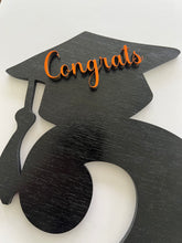 Load image into Gallery viewer, Celebrate your graduate with this personalized wooden graduation sign. An ideal alternative to a traditional guestbook, it features their graduation year, making it a great photo prop for the special day. Show your support in style with this meaningful keepsake.

