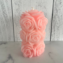 Load image into Gallery viewer, Bring timeless elegance and the warm glow of natural beeswax into your home with this handcrafted Rose Beeswax Pillar Candle. Beautifully sculpted with delicate rose petals, this stunning floral candle creates a cozy ambiance while showcasing the natural beauty of pure American beeswax.
