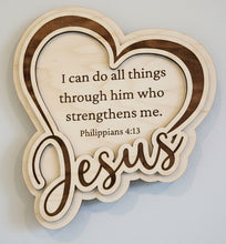 Load image into Gallery viewer, Heart-shaped wooden sign with layered wood borders and the word 'Jesus' in large script, featuring the Bible verse Philippians 4:13 on a wooden tabletop.
