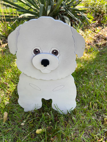Bring some furry love to your home with our charming Bichon Frise Dog Planter.  Not only does it welcome guests with it's adorable design, but you can also add a custom dog tag with your pet's name for an extra personal touch (additional $5).  The perfect gift for dog lovers, this planter is sure to bring a smile to anyone's face.  Get yours now and show your love for man's best friend.