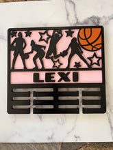 Load image into Gallery viewer, Celebrate your child’s achievements by displaying their metals on this beautiful award holder.  This 15” award holder will prominently display at least 12 metals and can be customized with your child’s name and your choice of colors.
