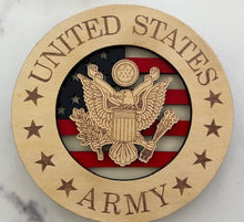 Load image into Gallery viewer, Celebrate the heroes that fought for our freedom with these Military Signs. &nbsp;These 9” round signs display a flag background and your choice of military insignias on the front. &nbsp;The perfect way to thank the veterans or active duty hero’s in your life. &nbsp;
