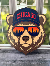 Load image into Gallery viewer, Show off your love for Chicago and hometown spirit with this bold bear sign! Featuring a cool bear dressed for chilly Chicago weather in a stocking cap and sunglasses, this layered design brings together classic orange and navy colors with unmistakable Windy City style.
