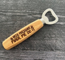 Load image into Gallery viewer, Pop open your favorite beverage in style with our engraved wood-handled bottle openers! Crafted with a durable stainless steel opener and a smooth wooden handle, these openers offer a comfortable grip and a sleek, rustic look.
