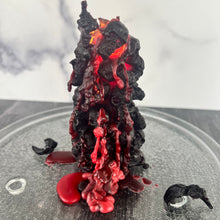 Load image into Gallery viewer, Unleash the spooky vibe with our one-of-a-kind bleeding skull beeswax candle. As it burns, watch in awe as the 'blood' oozes and the skulls roll off onto the plate, adding an eerie touch to your Halloween decorations. The glowing eyes and piles of skulls and bones make this pillar candle a must-have for gothic and fall decor. Perfect for gifting to skull-loving friends or for adding a touch of horror to any room. Get yours now and bring the creepy factor to your home!
