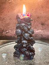 Load image into Gallery viewer, Unleash the spooky vibe with our one-of-a-kind bleeding skull beeswax candle. As it burns, watch in awe as the 'blood' oozes and the skulls roll off onto the plate, adding an eerie touch to your Halloween decorations. The glowing eyes and piles of skulls and bones make this pillar candle a must-have for gothic and fall decor. Perfect for gifting to skull-loving friends or for adding a touch of horror to any room. Get yours now and bring the creepy factor to your home!
