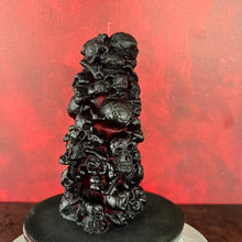 Load image into Gallery viewer, Unleash the spooky vibe with our one-of-a-kind bleeding skull beeswax candle. As it burns, watch in awe as the 'blood' oozes and the skulls roll off onto the plate, adding an eerie touch to your Halloween decorations. The glowing eyes and piles of skulls and bones make this pillar candle a must-have for gothic and fall decor. Perfect for gifting to skull-loving friends or for adding a touch of horror to any room. Get yours now and bring the creepy factor to your home!
