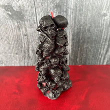 Load image into Gallery viewer, Unleash the spooky vibe with our one-of-a-kind bleeding skull beeswax candle. As it burns, watch in awe as the 'blood' oozes and the skulls roll off onto the plate, adding an eerie touch to your Halloween decorations. The glowing eyes and piles of skulls and bones make this pillar candle a must-have for gothic and fall decor. Perfect for gifting to skull-loving friends or for adding a touch of horror to any room. Get yours now and bring the creepy factor to your home!
