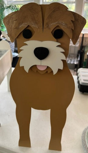 Bring some furry love to your home with our charming Border Terrier Dog Planter.  Not only does it welcome guests with it's adorable design, but you can also add a custom dog tag with your pet's name for an extra personal touch (additional $5).  The perfect gift for dog lovers, this planter is sure to bring a smile to anyone's face.  Get yours now and show your love for man's best friend.