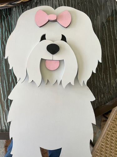 0Bring some canine charm to your home with our adorable Coton de Tulear Dog Planter. Not only does it welcome guests with its cute design, but you can also add a custom dog tag with your pet's name for an extra personal touch (available through our dog tag listing). The perfect gift for dog lovers, this planter is sure to bring a smile to anyone's face. Get yours now and show your love for man's best friend!