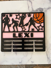 Load image into Gallery viewer, Celebrate your child’s achievements by displaying their metals on this beautiful award holder.  This 15” award holder will prominently display at least 12 metals and can be customized with your child’s name and your choice of colors.
