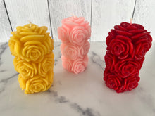 Load image into Gallery viewer, Bring timeless elegance and the warm glow of natural beeswax into your home with this handcrafted Rose Beeswax Pillar Candle. Beautifully sculpted with delicate rose petals, this stunning floral candle creates a cozy ambiance while showcasing the natural beauty of pure American beeswax.
