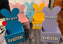 Load image into Gallery viewer, Make this Easter unforgettable with our Adorable Wood Crate Easter Basket, personalized with your child&#39;s name on top. Elevate the joy of the egg hunt and create lasting memories with these charming, customized Easter baskets designed just for your little ones.
