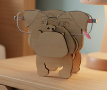 Load image into Gallery viewer, Let an adorable little dog keep watch over your glasses while you sleep! Our Dog Eyeglass Holders give your eyeglasses a designated place to rest while adding a little personality to your nightstand, desk, dresser, or reading area.
