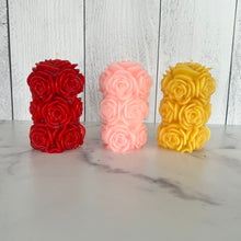 Load image into Gallery viewer, Bring timeless elegance and the warm glow of natural beeswax into your home with this handcrafted Rose Beeswax Pillar Candle. Beautifully sculpted with delicate rose petals, this stunning floral candle creates a cozy ambiance while showcasing the natural beauty of pure American beeswax.
