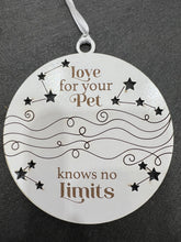 Load image into Gallery viewer, Celebrate your love for your pets with these Love For Your Pet Knows No Limits Ornaments.  Approximately 4” round.  Add paw prints for the perfect touch. 
