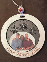 Load image into Gallery viewer, Add your picture to these adorable ornaments to create a treasured family keepsake.  You choose the wording around the outside, or add a name.  The possibilities are endless!
