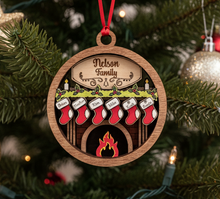 Load image into Gallery viewer, Celebrate everyone who makes your house a home with this beautiful Personalized Family Christmas Ornament. Featuring a cozy fireplace scene, personalized stockings, and your family name on the mantel, this hand-painted keepsake is a special way to celebrate your family at Christmas.
