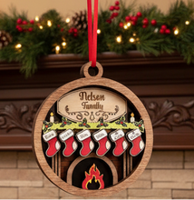 Load image into Gallery viewer, Celebrate everyone who makes your house a home with this beautiful Personalized Family Christmas Ornament. Featuring a cozy fireplace scene, personalized stockings, and your family name on the mantel, this hand-painted keepsake is a special way to celebrate your family at Christmas.
