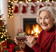 Load image into Gallery viewer, Celebrate everyone who makes your house a home with this Personalized Family Christmas Ornament featuring a cozy fireplace, customized stockings, and your family name on the mantel. This hand-painted keepsake is a beautiful way to celebrate your family and create a Christmas ornament you'll look forward to hanging on the tree year after year.
