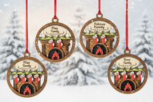 Load image into Gallery viewer, Celebrate everyone who makes your house a home with this beautiful Personalized Family Christmas Ornament. Featuring a cozy fireplace scene, personalized stockings, and your family name on the mantel, this hand-painted keepsake is a special way to celebrate your family at Christmas.
