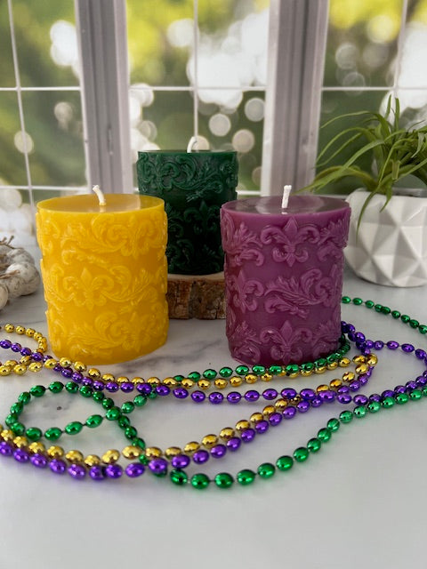 Elegant pillar candle embossed with a Fleur De Lis pattern is a beautiful year-round decorative candle and would complete any Mardi Gras table centerpiece or could make a fantastic gift for anyone who loves the New Orleans Saints or is of French ancestry.  The soft light of the beeswax illuminates the Fleur De Lis design beautifully as it lights up your room.  