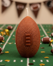 Load image into Gallery viewer, Kick off football season in style with this Football Beeswax Candle, handcrafted from 100% pure beeswax. Whether you’re decorating for game day, hosting the ultimate tailgate, celebrating the big championship game, or searching for the perfect gift for your favorite football fan, this unique candle is sure to be a touchdown!

