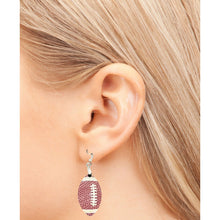 Load image into Gallery viewer, Score big on game day with our stylish Football Earrings! Designed with a realistic football-textured finish, these earrings are the perfect way to showcase your love for the game and your team spirit. Lightweight and easy to wear, they feature a sleek 1.5&quot; football-shaped design that adds the perfect sporty touch to any outfit. 
