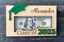 Load image into Gallery viewer, Personalized Graduation Money Holder, Cap &amp; 2025 can be in your choice of colors.  Wood design holds bills securely to make a lasting impression on your grad!

