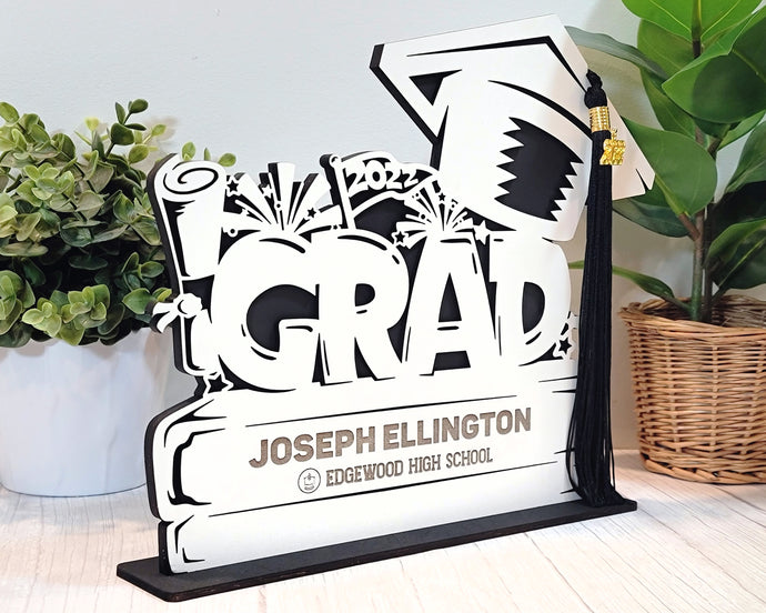 This Graduation Tassel Holder is the perfect way to commemorate your special event. It is designed to securely hold your tassel in place and is personalized with your name, graduation year or a personalized message. Show off your style and pride with a custom made holder that you can use to display your graduation tassel.  Available in 2023, 2024, 2025 and 2026 styles.  